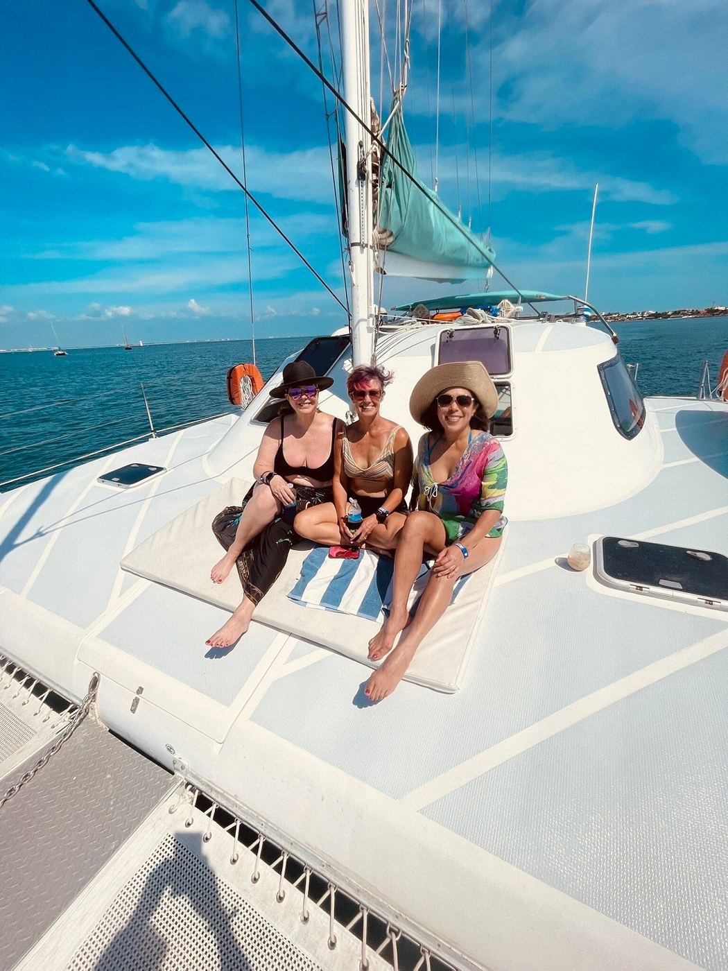 Three friends relaxing on the foredeck