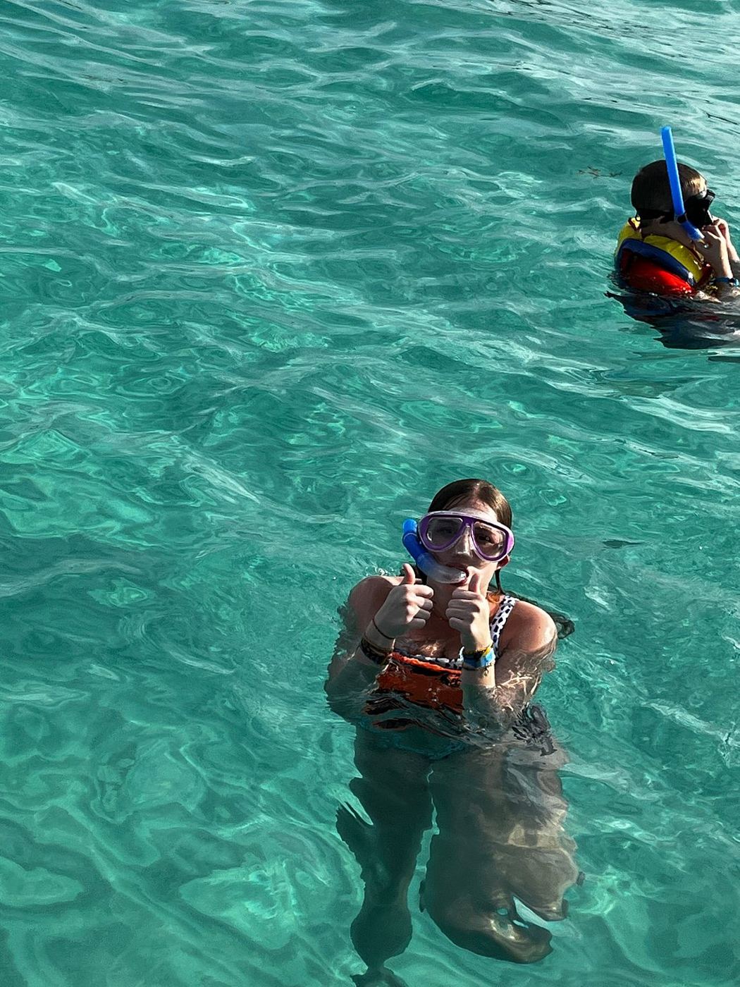 Guest snorkeling in clear water