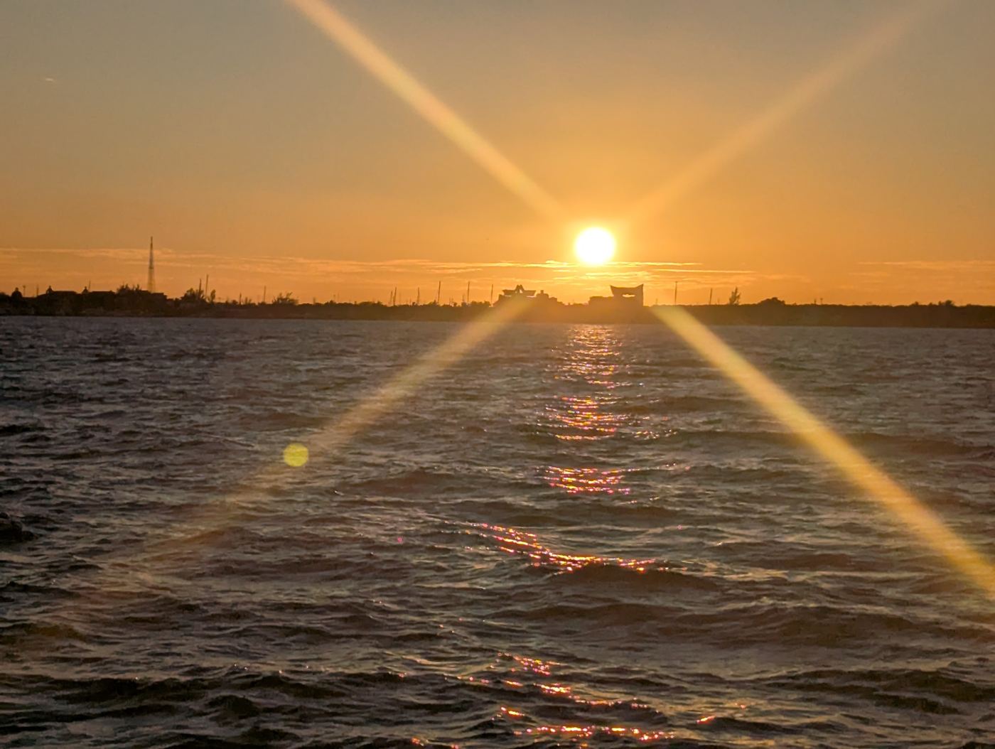 Sunburst over the water at dusk