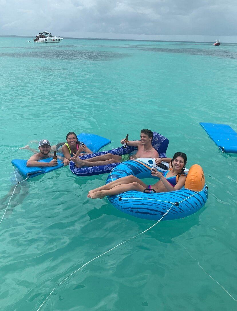 Inflatable floats in shallow turquoise water
