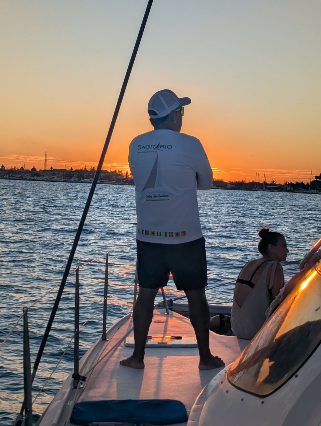 Captain watching the sunset from the bow